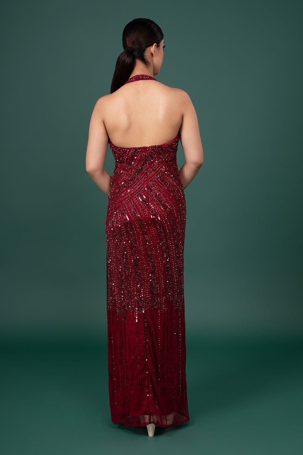 Wine Halter Neck Net Gown With Diagonal Sequin And Bead-Work Embellishments