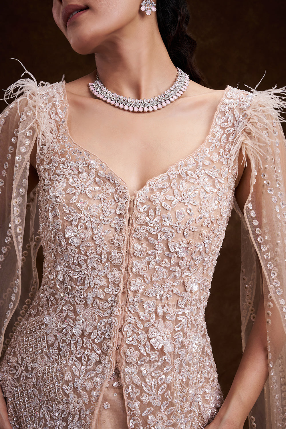 Beige Golden Net Bridal Lehenga with Feathered Cape Detail
