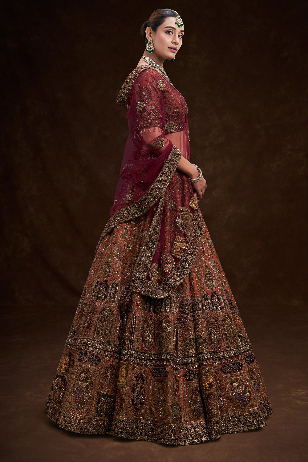Copper Rust Raw Silk Bridal Lehenga with Palatial Motifs and Zardozi Work