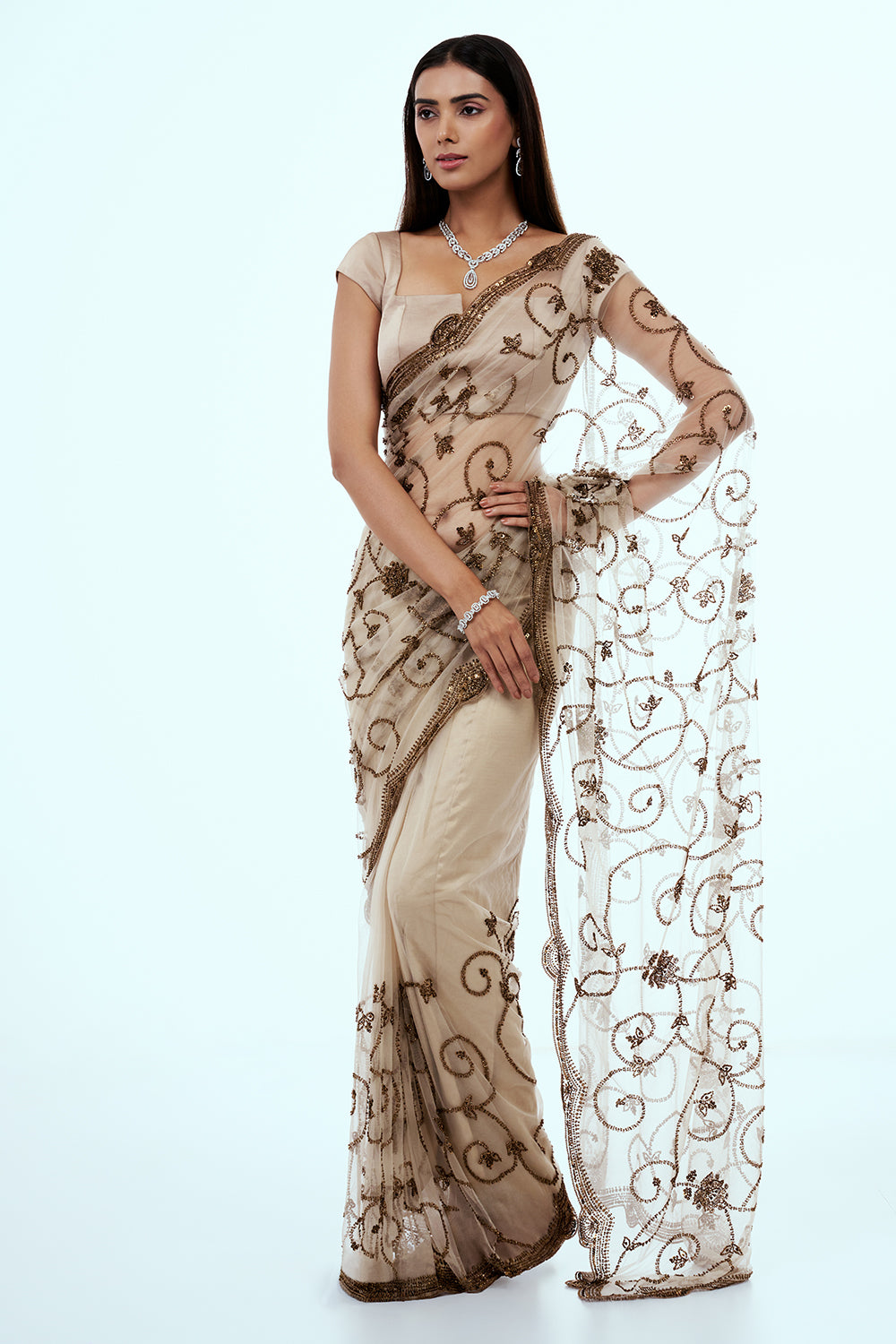 Ivory Net Saree with Bronze Cutdana Work