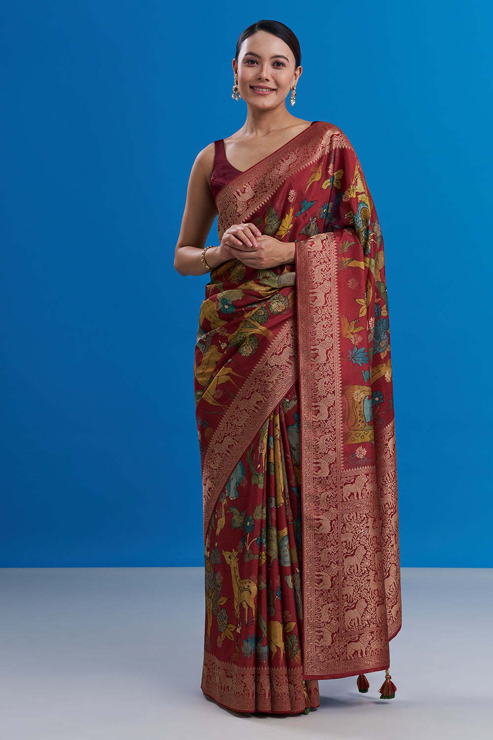 Maroon Silk Saree with Animal-Inspired Motifs Border And Unstitched Blouse