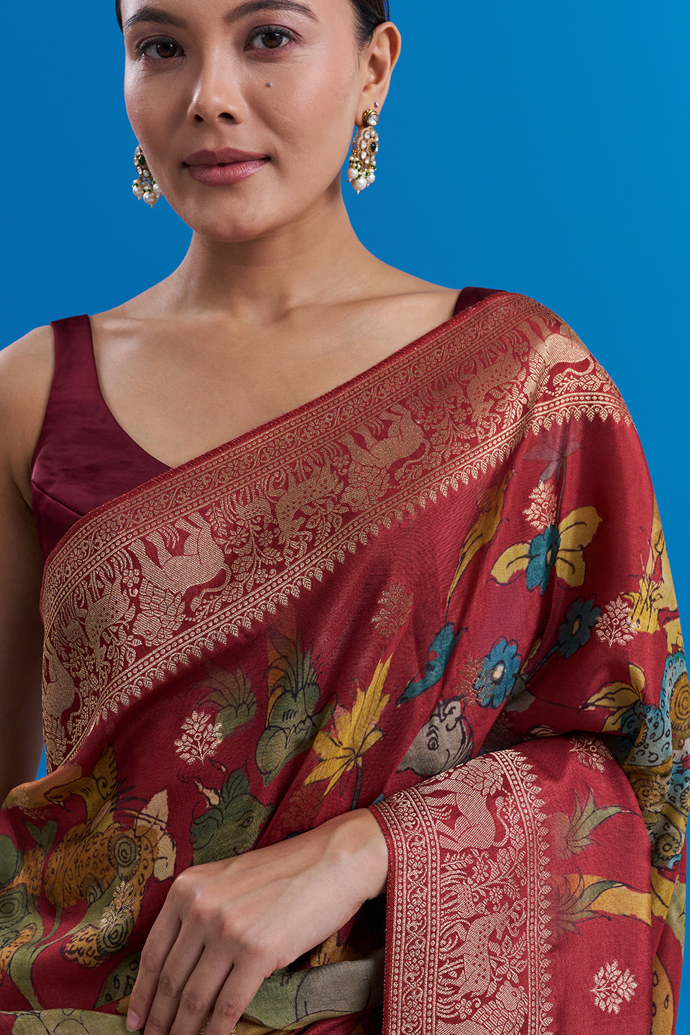 Maroon Silk Saree with Animal-Inspired Motifs Border And Unstitched Blouse