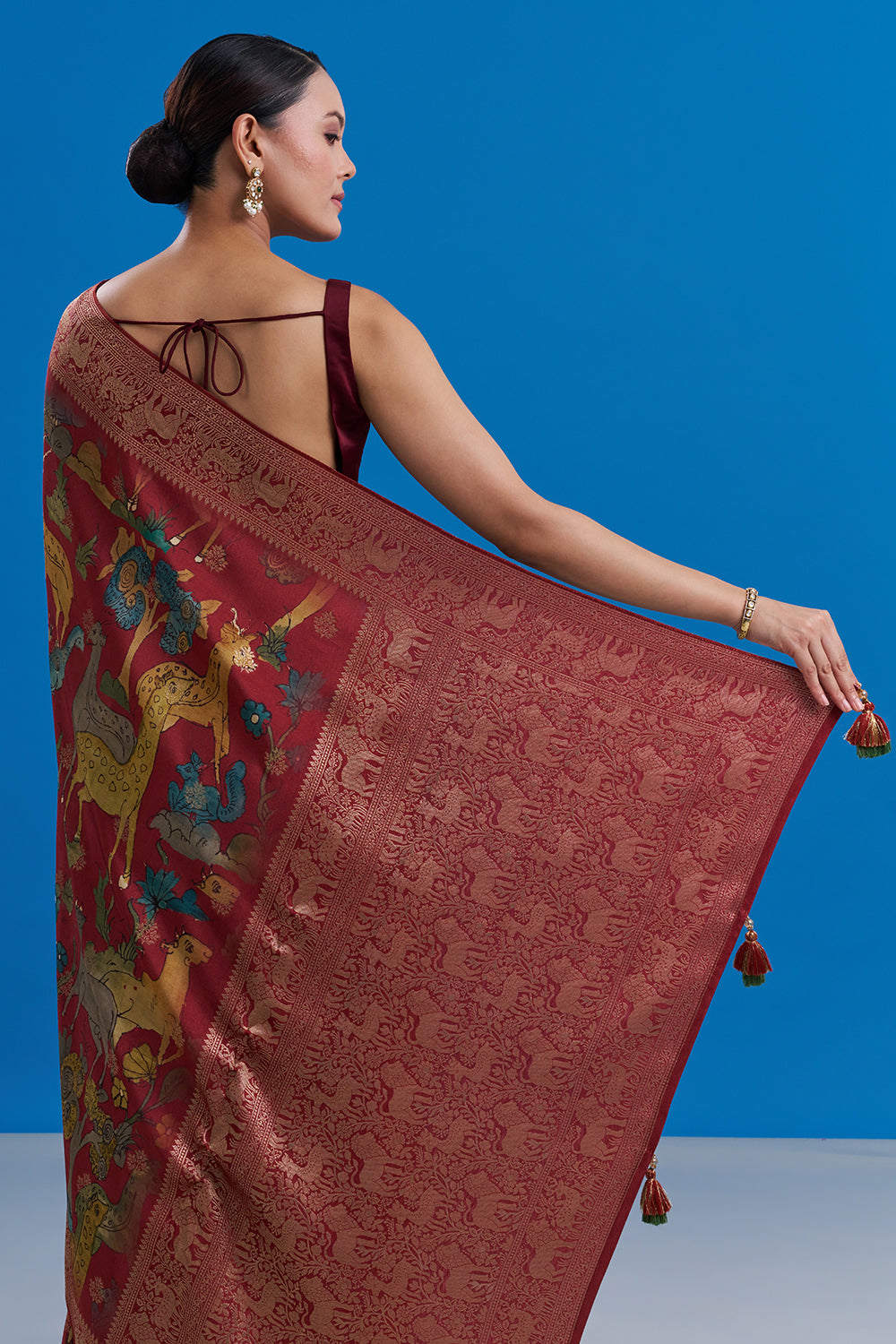 Maroon Silk Saree with Animal-Inspired Motifs Border And Unstitched Blouse