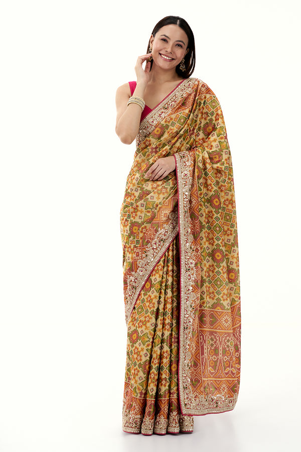 Multicolour Tissue Silk Saree with Patola Print and Embellished Border